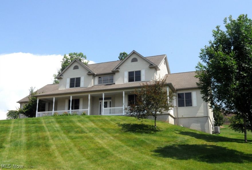 This beautiful 2 story 5 bedroom custom built home is located in Zanesville's Woodcrest neighborhood just minutes from Dillon Lake.  It features an eat-in kitchen with a gas range, ceramic and hard wood floors, a stunning granite island with both bar seating, semi formal dining for entertaining.  Also on the main floor you'll enjoy the executive office, a great room, laundry room, mud room and upstairs you'll discover 4 large bedrooms, walk-in closets including built in organizer and bonus room.    In addition the very spacious 3 car garage, there is a large pad for RV or boat storage or basketball.  Great unobstructed view from the front porch. Large back patio great for enjoying a BBQ or the hot tub.  The walkout basement is framed and electric ran, ready to have the walls finished to add over 2000 sq. ft of space for entertaining, mother-in-law apartment (including a private entrance from the garage), or more.  This home is nestled in at the top of the cul-de-sac.  Spotlessly mainta