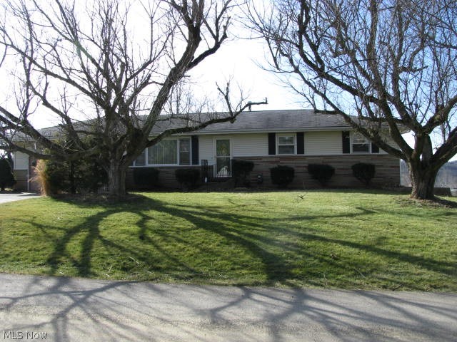 Great location for this ranch home in Bennett Addition, not far from town. Spacious living room, kitchen has breakfast bar, dining room has atrium door to deck, overlooking level backyard and beautiful view of the valley and countryside. Basement is partially finished with family room with bar and possible 4th bedroom or office. Mostly newer vinyl replacement windows, garage has workbench and built-in storage. Furnishings are negotiable. Being sold in "as is" condition.
