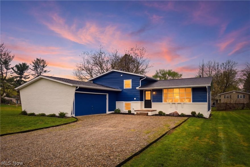 Welcome home to this beautifully renovated split-level set on a large lot with room to spread out inside and out. The main level offers an open, airy layout with a bright living space, dining area, and updated kitchen featuring premium soft-close cabinetry, granite countertops, waterproof LVP flooring, stainless steel appliances, and modern finishes throughout. A beautiful mudroom connects to the attached two-car garage, adding both style and everyday convenience. Upstairs you’ll find spacious bedrooms and refreshed bathrooms, while the lower level includes a cozy second living area with a stunning fireplace wall and walk-out access. New windows throughout and a new roof in 2025 add even more value and peace of mind. With its expansive yard, thoughtful updates, and move-in ready appeal, this home is full of charm and function.