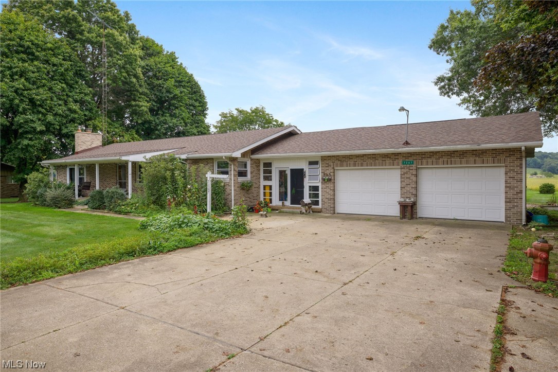 Looking for a lovely brick ranch on an acre with 3 bedrooms, 2 bathrooms and a beautiful back yard? Look no further and call today to take a look at this home! There is something for everyone here! Like to garden? There is room for a large one and a canning kitchen downstairs as well. Spacious rooms and check out the breezeway between the house and attached 2 car garage. Home has been well maintained and is move in ready. Great location near Brown Local Schools and convient to Malvern, Carrollton and Minerva - 30 minutes to Canton.
