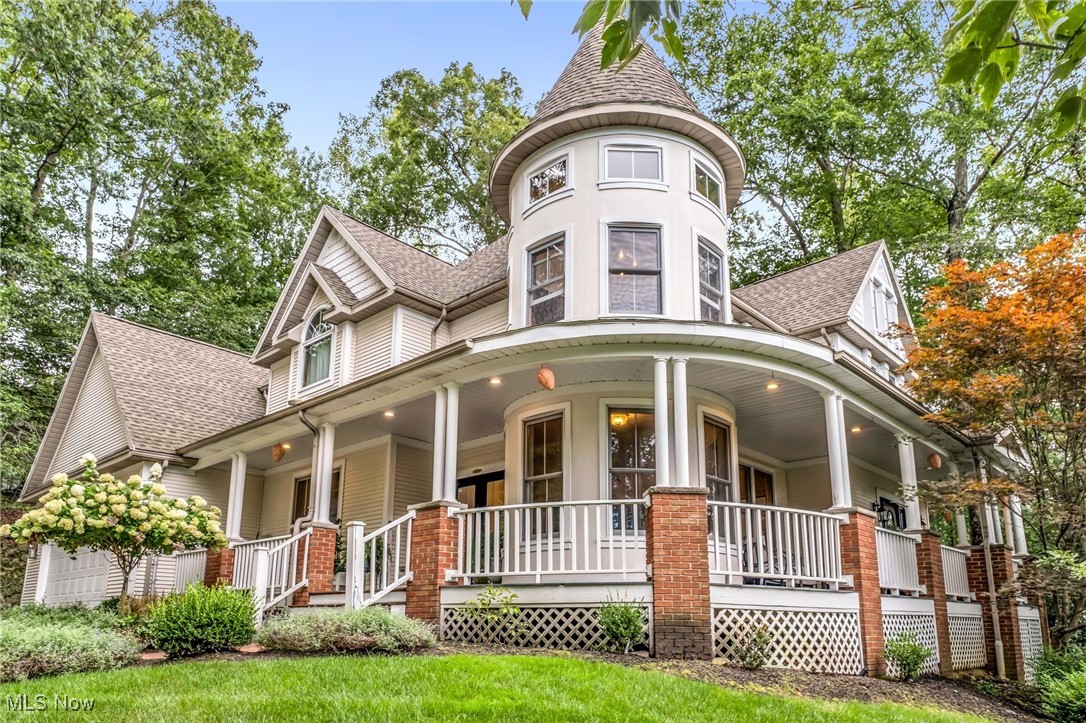 Welcome to 8851 Spring Valley Dr in Broadview Hts, a truly unique, vintage victorian meets modern farmhouse, 4-bed, 3.5-bath home filled with character & timeless charm. From the moment you arrive, the ample curb appeal & heated drive lead you to the inviting wrap-around porch, setting the tone for this special property. Inside, the 2-story foyer, rich woodwork, & large windows fill the home with warmth & natural light. The kitchen is a chef’s dream with quartz counters, custom island, stainless steel appliances, & plenty of built-in cabinetry, all complemented by a secondary dining space in addition to the formal dining room. Just off the kitchen, the family room features a striking fireplace, creating an inviting spot for gatherings & a study with built-in bookcases provides the perfect retreat for work or reading. The thoughtful floor plan showcases 4 spacious bedrooms, 2 full bathrooms, & the laundry all on the 2nd floor. The master suite offers a true retreat with a vaulted ceiling turret sitting area & the en-suite is complete with twin sinks, a luxurious soaking tub, & a separate shower, creating a spa-like oasis that feels both elegant & inviting. The remaining 3 bedrooms are also very spacious & share a full bathroom with quartz counters & newer custom stone shower. The newly finished basement with LVP flooring adds to the living space with a family room, kitchen area with an eating island, full bathroom, & a bonus room that can be used fas a play room, home gym, or extra study. The walk-up attic is a designer’s dream boasting high ceilings & natural light just waiting for your finishing touch. Outdoors, enjoy seamless indoor-outdoor living with a newer back patio with private views of a serene creek, perfect for hosting & entertaining. With its architectural detail, spacious layout, & updates throughout, this home is an ideal blend of elegance & comfort in one of Broadview Heights’ most desirable neighborhoods with a top rated school district.