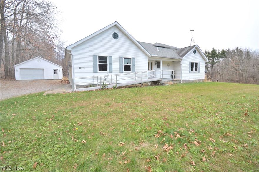 Open and spacious home nestled over 1000 feet from the road on 2.24 acres.  The first level of this home plays host to a giant eat in kitchen / dining room combination, a great room with vaulted ceilings, two huge bedrooms with private baths, a foyer, laundry room, and half bath.  A third bedroom with private bath comprises the second level. A full basement provides ample storage.  There are several handicap accessible features in this home.  Exterior features include a 2 car attached garage, a 2 car detached garage, front porch, rear enclosed porch, and rear patio.