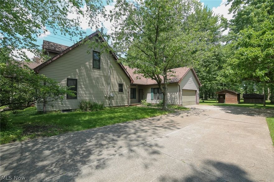 Turn the Key and Move Right In! This Stunning Beautiful Gem in Walton Hills is Waiting for You to Call Home! This 4 Bedroom 3 Bathroom Home Sitting on Almost a Full Acre Offers Plentiful Space Both Inside and Out! You Will Love the Peaceful Oasis this Lot Offers, and Abundance of Space this Property has to Offer! Spacious Open Concept 24 x 12 Kitchen w/ Eat In Area Offers Stainless Steel Appliances, and Storage at Every Turn! Large Beautiful Kitchen Flows Seamlessly Into Oversized Family Room w/ Wood Burning Fireplace is Perfect for Your Family to Relax! First Floor Master Suite Has a Walk-In Closet and En Suite Bathroom w/ Stand in Shower & Soaking Tub! Additional Bedroom on First Level is Perfect for Nursery or Home Office. Cozy 16 x 11 Living Room, is Perfect Reading Room. Home is Bathed in Natural Light! Second Floor Features 2 Cozy Bedrooms, Sharing a Full Bathroom Connected to Loft Area Perfect for Guests, or area for the Kids to Complete Their Homework! Entering From Large Heated 2 Car Garage You Will Find Spacious Foyer w/ First Floor Laundry Room. Huge 42 x 24 Unfinished Basement on Lower Level, Plumbed for Full Bathroom Waiting to be Finished to Your Liking! Additional Extra Large Crawl in Basement is Perfect for Storage! Updates Include: Furnace ('22), AC Unit ('22), Hot Water Tank ('22), Sump Pump ('23), Washer & Dryer ('19), All Newer Appliances Stay, Roof is at its Half Life, and SO MUCH MORE! Large, Wooded Lot, Includes Fire Pit, Outdoor Heated Cabin Perfect for a Workshop, Additional Storage Shed, and Perfect to Enjoy the Tranquil Back Yard. This Impeccably Cared for Home is Waiting for You to Move In! Private Setting While Minutes From the Freeway, and Close to All the Amenities! This Beauty Will Not Last! Call to Schedule Your Showing Today!