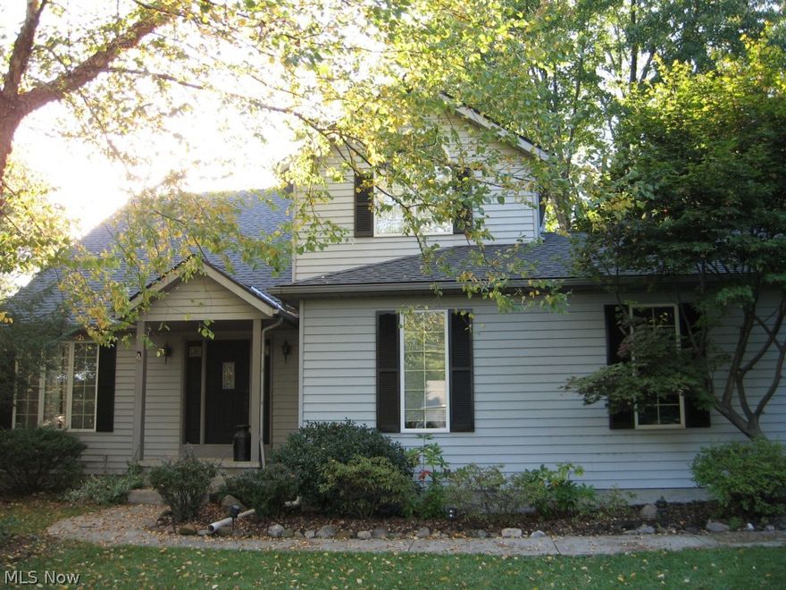 Unique Opportunity to own &enjoy this Custom Built Dramatic and Exciting colonial situated on a half acre wooded lot on a desirable street/Neighborhood! This spacious home will greet you with soaring ceilings & new gleaming attractive hardwood floors through first floor...the custom spindled staircase leads to 2nd floor loft/library! Open premium kitchen w/newer stainless appliances that is open to the light filled family room with gorgeous fireplace...views of the outstanding back yard. Formal Dining leads to Living Room. Owner's suite include volume ceilings & double doors...includes walk in closet, sitting/office area and glamour style bath w/dual sinks. Full large basement. Many fresh updates throughout including newer roof, landscaping and side load garage...Large drive for additional parking.  Tons of $$$ recently invested in this fabulous home: newer roof, HVAC, shed, flooring, more.