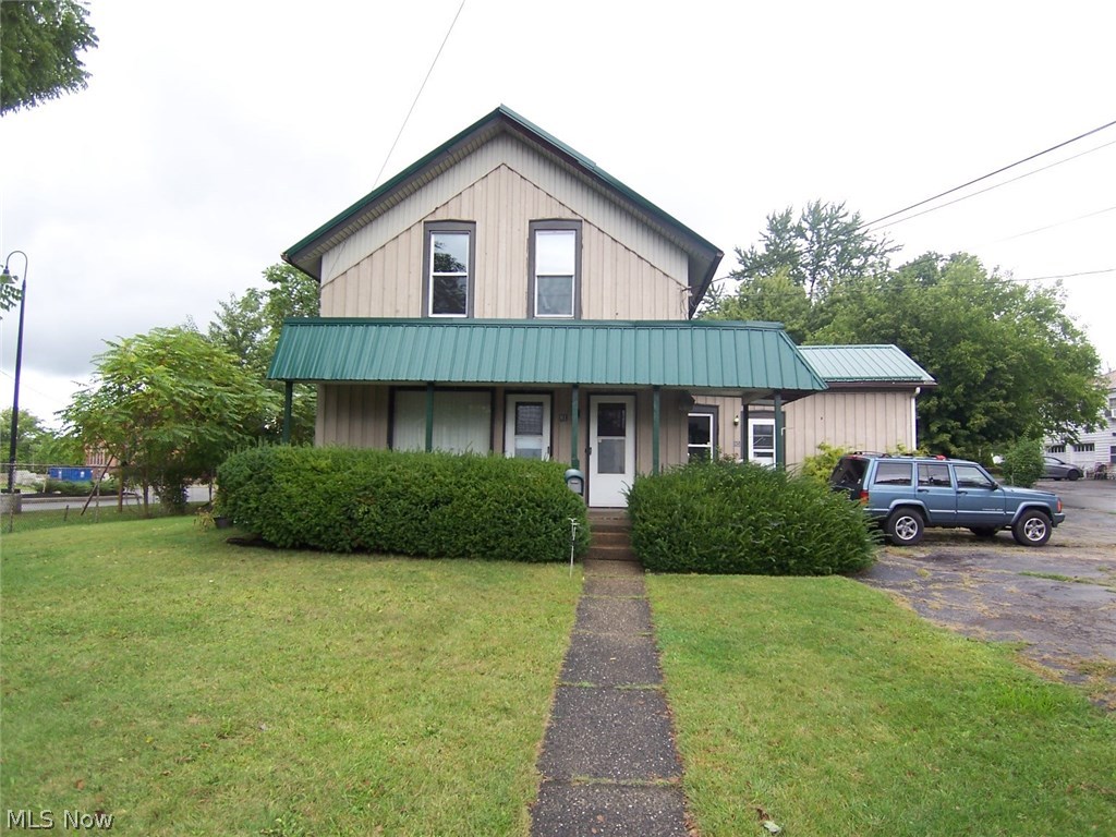 Fantastic duplex and storage opportunity in Tallmadge. Many potential uses for this property, including: owner occupied or investment duplex, office or commercial use, storage garages etc. Conveniently located near Tallmadge Cir and the police station. Many updates have been done including: newer electric, plumbing, furnace, AC, metal roof, and windows. Call for your showing today.