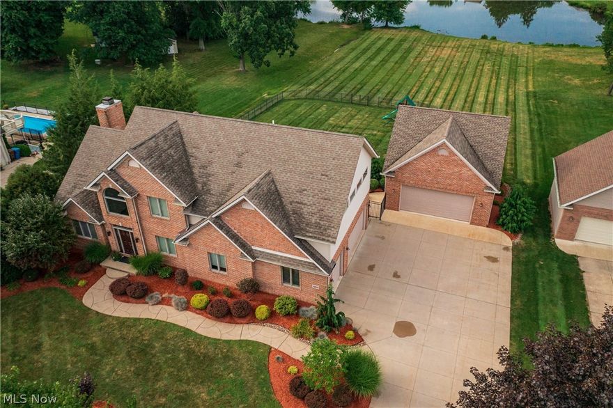 Stunning custom Jamestown built Lake Front property located on Tweed Lake in the Coventry Local School District. Vacation year round in this amazing property that offers breathtaking views and a home with quality finishes and recent updates. The open concept Living area offers views of the lake and your private backyard from every angle. There is a space for everyone in this home, offering Formal Living and Dining areas, Eat-in Kitchen, 2 Story Great Room, Sun Room and 2 possible Office areas you won't be lacking for rooms. The updated main level boasts white oak plank hardwood floors, custom Schlabach Kitchen cabinets, gorgeous granite counters, Stainless steel Thermador appliances, Coffee Bar and more. In addition, The 2 Story Great room has a custom travertine tile faced gas log fireplace which opens into the bright Sun Room overlooking the water. The Owner's retreat offers ample sleeping and sitting spaces along with a newly updated Owner's Bath featuring heated tile floors, two sink areas, water closet and oversized Carrara marble tile surround shower with seats and 3 shower heads. Total square footage of 4297 includes the finished walk out Lower Level offering the 3rd full Bath, Bar Area, Game Area, Family/Media room with fireplace and 4th Bedroom/Office. For the car lovers in your family, enjoy the 3-car attached and 2-car detached garages! This lovingly cared for home is truly magnificent. Welcome Home!