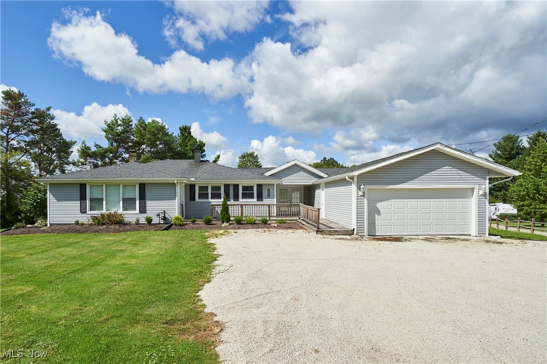 Welcome to this beautifully maintained ranch home nestled in the heart of Richfield, offering just under an acre located in the highly sought-after Revere School District. This home offers 3 spacious bedrooms, 2.5 baths, and flexible living arrangements. The kitchen features stainless steel appliances, granite countertops, a center island, and a built-in desk – perfect for meal prep and multitasking. The large family room invites relaxation with a cozy wood-burning fireplace. The primary suite includes a full attached bath and an impressive walk-in closet. An additional bedroom features a full bath. A hallway connects both sides and includes a convenient half bath and a dedicated laundry room, providing practical separation and easy access. The other side includes a spacious bedroom, a comfortable living room, and a private office with French doors, great for remote work or as a potential 4th bedroom. Enjoy outdoor living with both a front and back deck, plus a paved patio, perfect for entertaining or relaxing in your private backyard retreat. A 2-car attached garage provides ample storage and convenience. Don’t miss your chance to own this move-in-ready home. Schedule your private showing today!