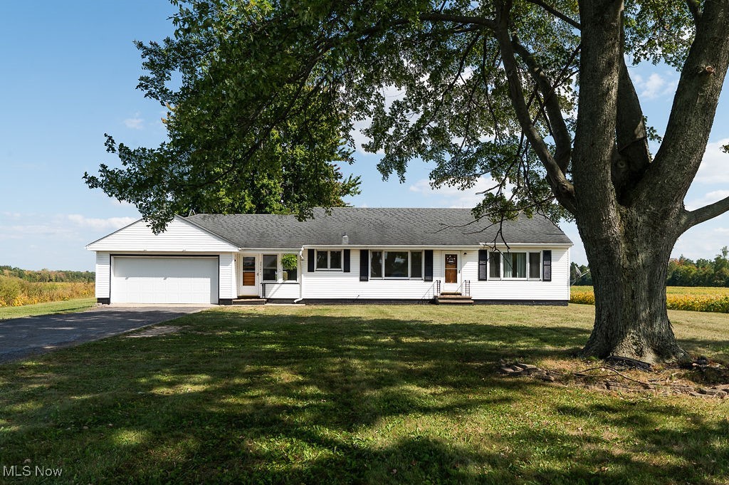 Beautifully updated country ranch with private yard, large kitchen, and cozy breezeway. This inviting home offers bright, open living spaces and thoughtful updates. Step inside to find a living area with tons of natural light, a gorgeous remodeled eat-in kitchen with a farmhouse sink. The breezeway offers additional living space and access to the large private backyard, featuring an above ground pool. The clean and functional basement is perfect for a game room, entertaining, or relaxing! Do not miss this unique opportunity!