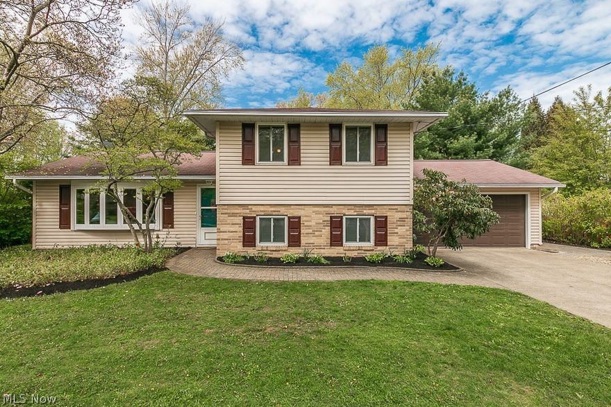 Beautifully renovated sprawling split level!  Every room is a pleasure to show!  Fall in love with the Eat in Kitchen featuring newer flooring, stylish backsplash, and newer sliding glass door to spacious 24' x 24' deck!  Both full Bathrooms have been tastefully updated as well!  Lower level Family Room currently being used as 4th Bedroom and features hand made sliding barn door!  Mud Room/Laundry Room area is a dream with with abundant cabinet and counter space for folding!  Just in time for warm sunny days, unwind in your own back yard oasis!  Huge patio in addition to deck space enjoy!  Fully privacy fenced in, ideal for kids and pets!  This is the one!