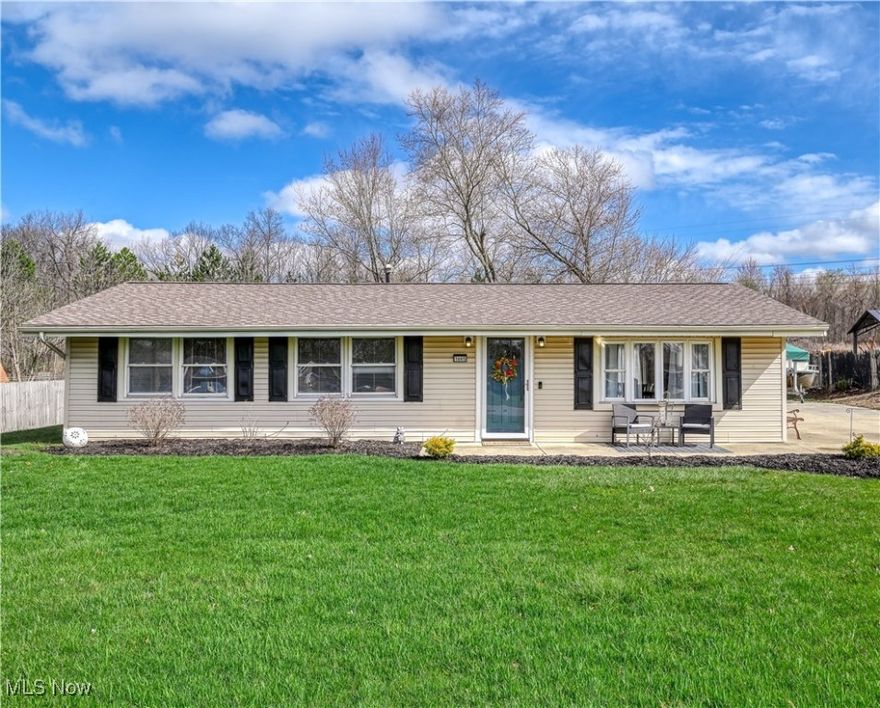 Welcome to 1695 Pike Parkway! This charming and updated ranch home spans over 1,300 square feet and features 3 bedrooms, 1 bathroom, and a versatile bonus room addition. The home showcases beautiful new flooring and recessed lighting, creating an inviting atmosphere throughout. The spacious living and dining area offers various layout options for furnishings. The large, bright kitchen is stylishly designed and equipped with stainless steel appliances, abundant butcher counter space, and plenty of cabinet storage. Off the hallway, there are three comfortably sized bedrooms featuring the open closet concept. The back bonus room serves as an ideal flexible space for your needs, whether it be a home office, a sitting area, or a potential fourth bedroom. The main bathroom is updated with light marble tile and a dark wood vanity. Outside, the backyard includes a patio area, a fenced yard, a double-wide driveway, and a large two-car garage with a side carport parking. This home is centrally located in the heart of Streetsboro, close to all shopping, dining, and freeways. Additional improvements include a new roof (2022), H2O tank (2023) dishwasher/microwave (2025). Schedule your showing today and be settled in before summer to enjoy!!