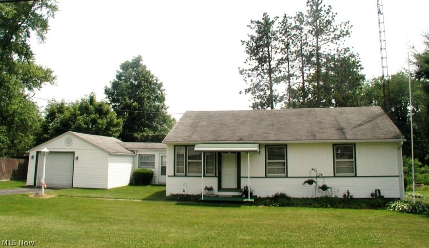 Adorable & inviting bungalow that rests on 2 lots. 3 bedrooms plus 1 bath offers hardwood floors through-out.  New furnace in 2014 plus other updates. Cozy breezeway. Back deck to sit and relax on.  Roomy back yard with new landscaping trees and shed for your supplies.  Just neat as a pin! Great location and PRICE!