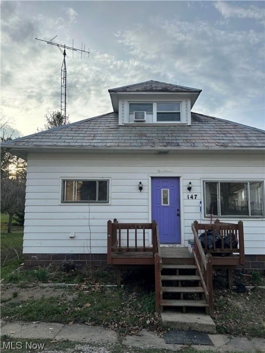 Darling 3 Bedroom (could be 4) bungalow. 
Large living room with fireplace & Dining room.
Some original wood floors.
3 bedrooms on the main floor (1 converted to laundry) 
Another bedroom & a 1/2 bath upstairs.
Gas heat with public sewer & water.
Large fenced back yard.