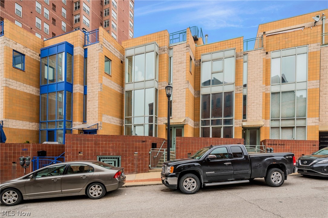 Welcome to this stunning & rare townhouse in Downtown Cleveland. 1407 West 10th at Kirkham Place is nestled in the historic warehouse district just above the newly developed restaurant and entertainment destination of the Flats, East bank. This 4 story townhome has everything you could want in a city home. With an open kitchen for entertaining, dramatic 2 story ceilings & 4 outdoor spaces including 2 rooftop decks with unparalleled views of the city’s gems. Imagine you and your guests sharing a bottle of wine on the rooftop deck while watching ships pass on the river, true city living. A location second to none! The master suite features floor to ceiling windows, and a beautifully renovated master bath with tile shower with glass doors, complete with a beautiful new vanity. Newly renovated second full bath and first floor half baths as well. Entertaining is a must with the gorgeous views from each outdoor space. For your convenience there is 3rd floor laundry down the hall from the be