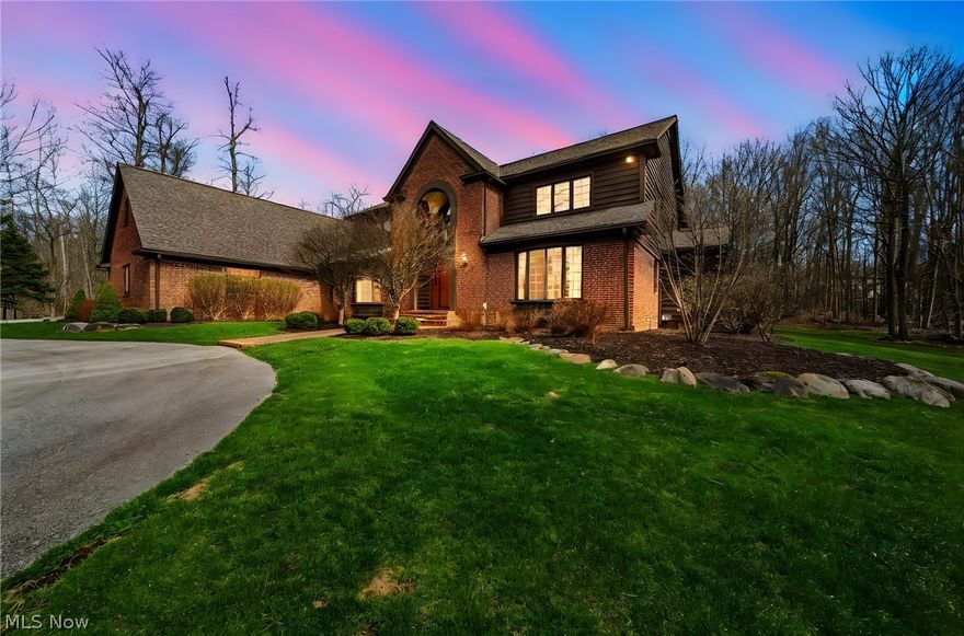 Welcome to this elegant luxury colonial set on an expansive 5+acre private wooded lot in the heart of Gates Mills. Offering 4,356 square feet of beautifully designed living space, this exceptional home features 4 bedrooms, 3 full baths, and 2 half baths, combining timeless architecture with modern comforts. A dramatic open foyer welcomes you into the home, leading to a stunning family room with vaulted ceilings, skylights that flood the space with natural light, and a wood-burning fireplace ideal for cozy gatherings. The thoughtfully designed layout offers effortless flow for both everyday living and entertaining. The spacious gourmet kitchen is equipped with granite countertops, a large center island, and all appliances included, making it a true hub of the home. The adjacent formal dining room showcases a beautiful tray ceiling, creating an elegant setting for hosting family and guests. Additional highlights include a newer roof (replaced within the last 5 years), exterior professionally painted in 2025, a 3-car attached garage, and a full unfinished basement offering endless potential for future customization. Step outside to an enormous wraparound deck spanning the entire back of the home, providing peaceful wooded views and the perfect backdrop for outdoor entertaining or quiet relaxation. Conveniently located near freeway access, shopping, and parks, this property offers the rare combination of privacy, space, and accessibility an outstanding opportunity to own a premier home in one of Northeast Ohio's most desirable communities.