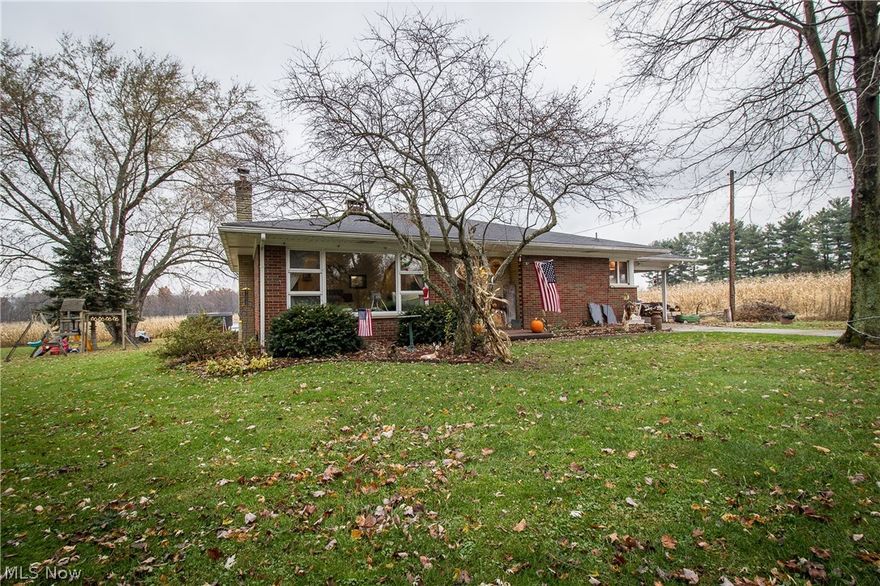 ALL BRICK RANCH IN TUSKY VALLEY SCHOOLS! You will love the neutral decor that complements the refinished hardwood floors throughout a majority of the home. The family room offers large windows allowing tons of natural lighting into the room with easy access to the kitchen. The galley style kitchen features tile floors, refinished counters and cabinets, updated glass backsplash, and space for a table! Each of the bedrooms are nicely sized with hardwood floors and neutral decor with access to the full bath. The lower level is partially finished and offers a spacious rec room with a full bath. The backyard is over half an acre of land with a 10 x 12 storage shed and beautiful country views! Updates include sump pump 2005, sink/dishwasher 2014, refinished hardwood floors 2014, insulated attic 2015, septic tank 2015, 100 amp panel 2017, all dates approximate.