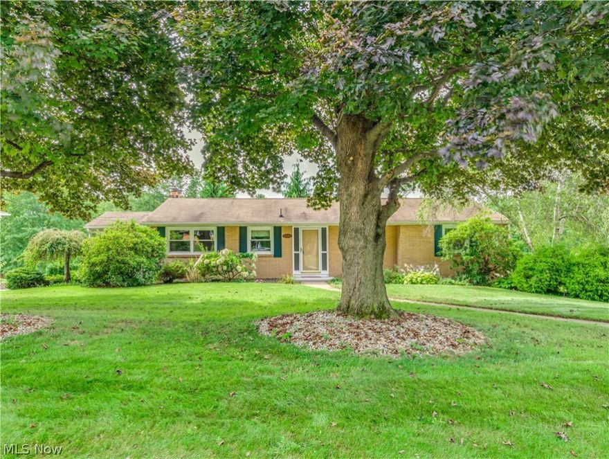 Brick ranch in North Canton city schools with a full finished walkout on almost 3/4 of an acre. This charming home features a spacious living room with new carpet, an attractive electric fireplace, and picture windows overlooking the beautiful backyard. The eat-in kitchen offers plenty of cabinets storage, a breakfast bar, a brand new stove & fridge (delivered on Sept 9th), and a dinette area.  There is a privacy door between the main area to the 3 bedrooms and a full bath (with a large vanity & tile surround shower).  Downstairs is a lovely family room with a gas fireplace (white mantle/bricks surround) with a great view and a walkout to the patio (with firepit) to enjoy the nice backyard. There is also a convenient full bath with a walk-in shower and a large laundry area with a lot of storage space on the lower level.  Oversized 2-car garage (21x27) with a large cement driveway.  Beautiful side-covered patio. Updates include the whole house carpet, new windows excluding garage window