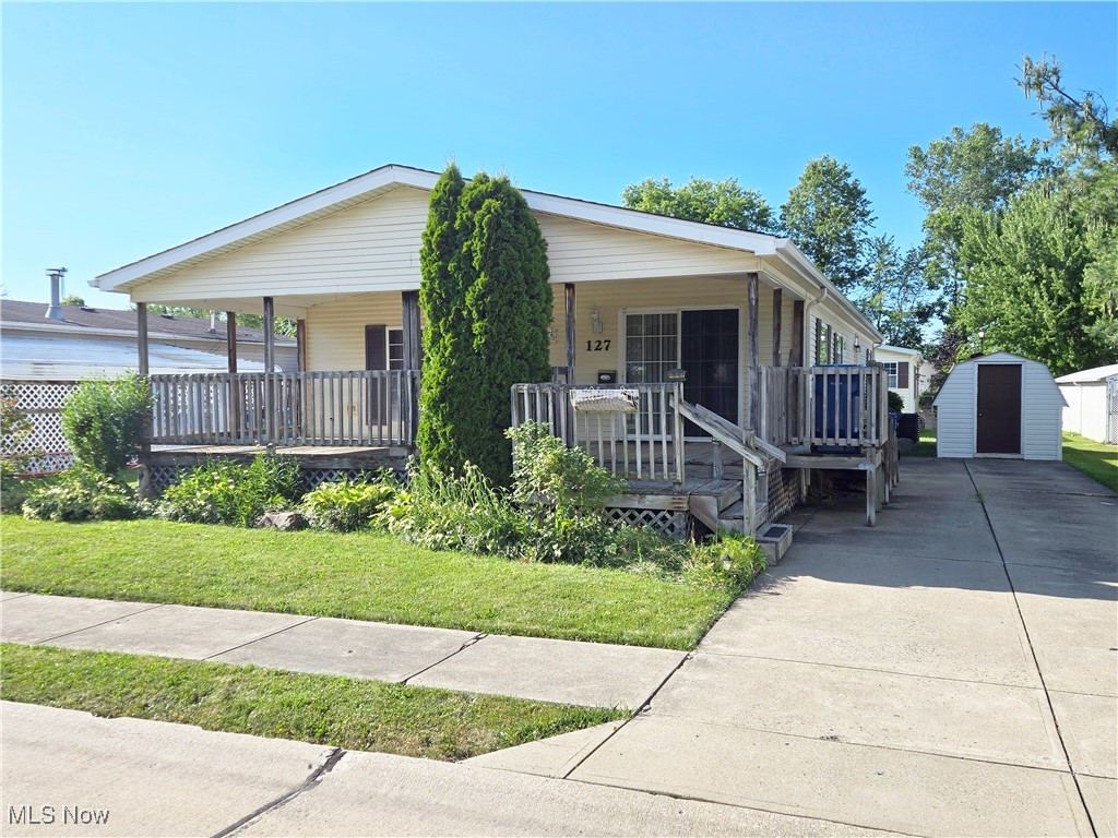 This home combines comfort, functionality, and a prime location in Amherst. Enjoy spacious living with over 1400 square feet of open floor plan with cathedral ceilings. This ranch home offers 3 bedrooms, 2 with walk-in closets, and an ensuite boasting a large tub, shower, double vanity and skylight. The main bathroom includes a new accessible shower and skylight. An Island kitchen featuring honey oak cabinets, complete with a refrigerator, gas range, and dishwasher. The utility/laundry room is equipped with a sink and ample cabinets for practical storage. Upgrades are new air conditioner and newer roof. There’s a 28x14 covered front porch with steps and a ramp for easy access and a concrete driveway accommodating up to three cars, plus a shed. Situated across the street from a park and playground on a quiet street. Relax and enjoy a low maintenance lifestyle. Quick access to Rt. 2 and Ohio Turnpike.