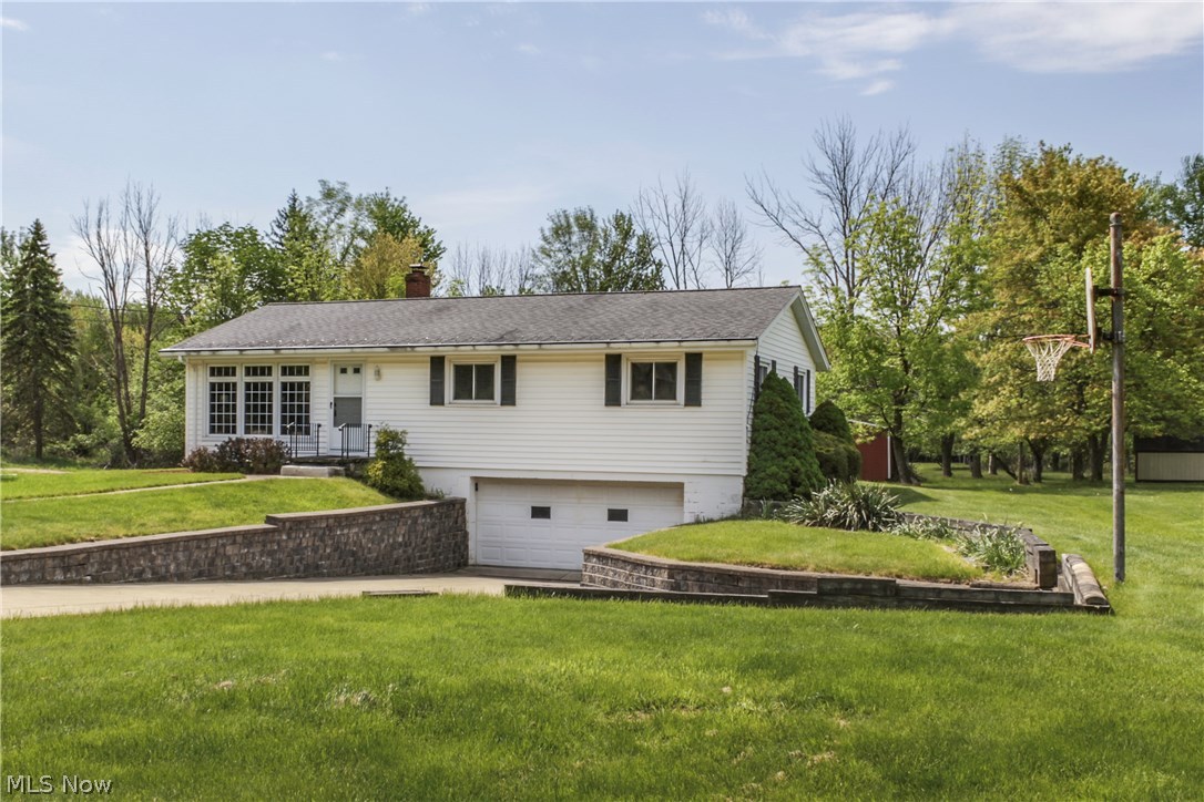 Dont miss this move in ready raised ranch in Broadview Hts! This well maintained home boasts a large and updated eat in kitchen with plenty of counter and cabinet space as well as brand new floors and fresh paint! Step out of your dining area to enjoy your expansive back yard and barn from your beautiful Trex Deck with retractible Sunshade awning! Relax in your sunny and spacious living room with large updated picture windows, fresh paint, and newer carpet. Down the hall you will find 3 nicely sized bedrooms with new carpet and paint, as well as a spacious bathroom with plenty of counter space! Enjoy the walk out basement with lots of room for storage plus a bonus rec room for additional space to enjoy and spread out! Attached, oversized 2 car garage too! First floor laundry and pantry off the kitchen make this home perfect for easy one floor living! New front door, fresh paint, new LED light fixtures and ceiling fans, and replacement windows throughout! New sump pump too! Br
