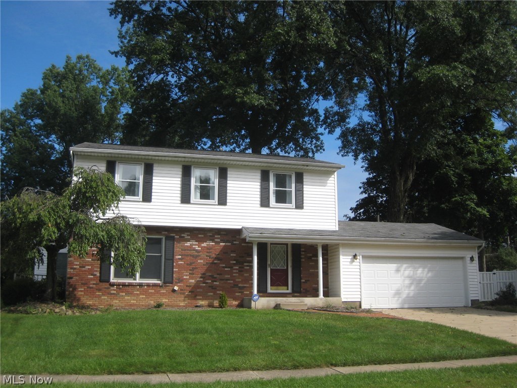 Welcome to this great spacious 4 BR 2.5 bath colonial. As you step into the foyer, you will love the gleaming hardwood flooring throughout. As you walk through the living room you will notice the crown molding which continues into the dining room with lighted china cabinet, open to the updated kitchen that features an island, pantry, corian counter tops, hardwood floors and appliances. French doors open to the amazing 24x17 sun room with hardwood flooring, vaulted ceiling with skylights, gas stove/fireplace and electric baseboard heating. The sliders walk out to the patio and deck. Great for entertaining and family gatherings! The family room has built in entertainment center and slider that, too, walks out to the deck and patio. Updated half bath off the tiled foyer w/double guest closet. The thoughtful design creates an open, flowing feeling throughout the first floor living area.. The upstairs has 4 spacious bedrooms, wood floors and ample closets. Full remodeled bath, with step in shower, off the master and main bath, with tiled tub/shower, is remodeled with vanity and lighting. The lower level features a rec. room equipped with walls of cabinets perfect for an office, play room, crafts, projects or man cave. This home is in move-in condition and offers a Home Warranty, too. Close to schools, shopping, Rt. 8, and Kent State. Fast possession! Stop by and take a look!