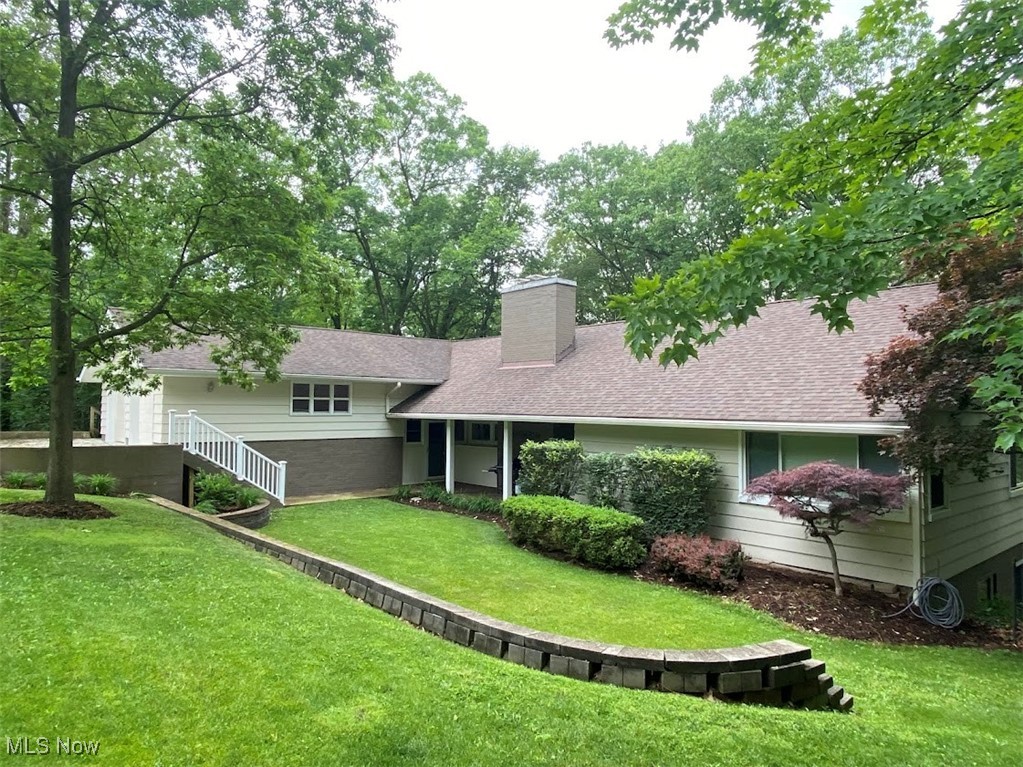 Welcome to this stunning 3,826 SF multi-level home in the highly rated Highland Local School District. Nestled in a serene, private setting with panoramic views of the wooded valley, this unique property includes a charming log cabin tucked into a peaceful ravine—perfect for a quiet retreat. The home features multiple outdoor living spaces, including spacious upper and lower decks, a tranquil front porch, and scenic views from nearly every room. Inside, the main living room boasts soaring 11-foot ceilings, a floor-to-ceiling stone fireplace, and custom built-in cabinetry. The kitchen is a chef’s dream with upgraded granite countertops, stainless steel appliances, and a large family island. The primary suite includes a luxurious en suite bath with heated floors and a walk-in closet. Downstairs, enjoy a cozy family room with a wood-burning fireplace and a large wet bar with built-in cabinetry—ideal for entertaining. The oversized laundry room includes a washer and dryer, plus ample space to add a second kitchen. A beautifully remodeled bonus room offers flexible space for a playroom, fitness studio, or home theater. The home also includes a large workshop area for hobbyists or DIY enthusiasts. Recent upgrades include a newer septic system, enhanced well water system, new dual-zone central air conditioning, and more.
This is not your typical ranch—it's a spacious, thoughtfully updated home with character, charm, and endless possibilities. A must-see property!