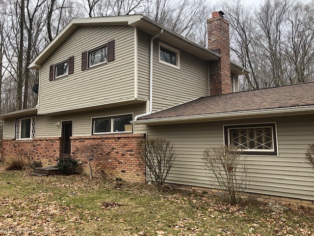 Renovation opportunity! Kitchen has already been gutted, ready to remodel. Home needs some other touches as well, so this is a great opportunity to either rehab and sell, or buy and renovate to have some sweet equity. Quiet, cul-de-sac street in Russell (Novelty postal code). 1.5 acres of mostly-wooded lot. Traditional split level floor plan with 3 bedrooms and a full bath up, plus an office/4th bedroom on the 1st floor. Huge living room and formal dining area right off the kitchen, plus a family room with fireplace just a couple steps down. 2nd full bath is on the 1st floor for possible 1-floor living. Other features: full basement, newer broiler and hot water tank, upgraded electrical.