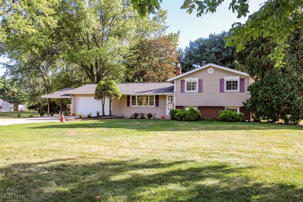 Just a short walk to the hike and bike trail and a few minute drive into town - you won't want to miss the convenience and serenity of this home. Enjoy a double lot backing up to Windmill Lakes Golf Course, an attached garage and attached carport, rear concrete patio, and much more. Inside you will find three bedrooms and a full bath on the upper level, the kitchen, dining and living room on the main level and an additional living room, full bath, a laundry room, and office space on the lower level. New roof in September 2025. Well maintained and cared for home ready for a loving new owner!