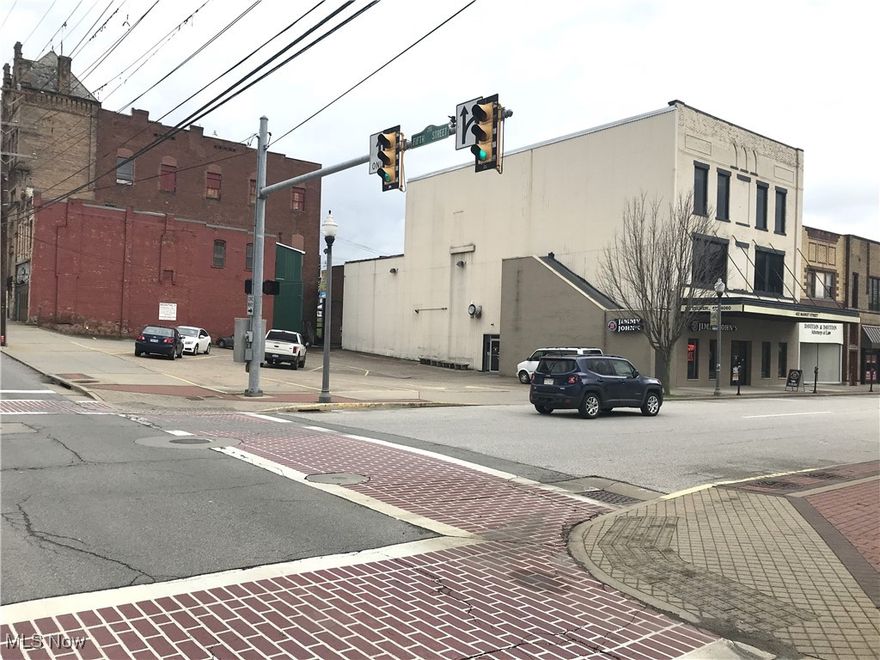 Great "Downtown Parkersburg" location producing good income with potential for much more. Jimmy John's on the first floor (only using 1650 of the 6,000 first floor square footage available) is one of the busiest fast food shops in Parkersburg, and pays ALL building property taxes, insurance, and Police, Fire & Floodwall fees. Over half the first floor is vacant and ready for a New Business venture. Nearly 5,000 s/f on the second floor used as Office space/Call center is currently vacant and is ready to lease out. Third floor is being used as a large apartment. New roof in two stages of 2014 / 2019. The parking lot has 20 spaces out front (5th and Market St) an additional lot behind the property with alley access (4 Parking Spaces). Total of 8 Parcels : 05-93-00270000, 05-93-00260000, 05-93-00250000, 05-93-00240000, 05-93-026A0000, 05-93-022A000, 05-93-022B000, 05-93-00220000.