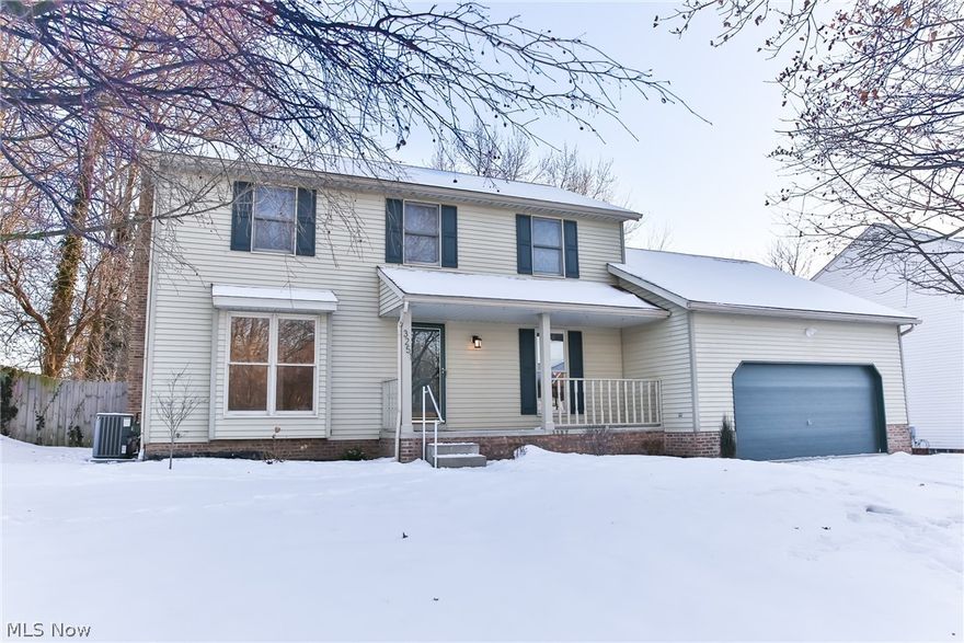 Welcome home! This beautifully updated colonial in Cuyahoga Falls is the home you have been looking for. As you walk in the front door you are greeted with newer golden oak floating hardwoods (laminate) that lead you into the open eat-in kitchen and family room with a stunning wood burning fireplace. The updated kitchen (2015) is sensational with beauteous quartz counter tops and stunning chocolate maple cabinetry. The flooring is state of the art with the new deluxe grouted vinyl flooring which runs down the hall, into the 1/2 bath, first-floor laundry and bonus room that could be used as a 4th bedroom or quaint home office. The first floor also includes an enjoyable living room and fabulous dining room. Plenty of space for hosting any event or holiday for family and friends!! Speaking of hosting, the fully fenced in back yard with huge deck is great for barbecuing and enjoying the picturesque views and wonderful sounds of nature! Once it is time to retire for the evening, head upstai
