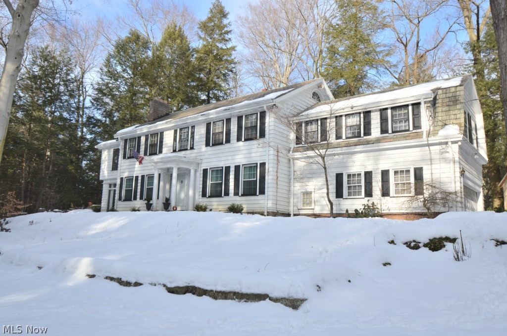 Imagine living on the end of a quite serene street where Mill Creek Park and Lake Cohasset are your backyard. This 1920's home is nestled on a beautiful wooded lot where mother nature is your neighbor. This five bedroom and three and half bath home is where your imagination will run wild with it's neutral tones and colors. Through the front door you are welcomed by a large spacious great room with a wood burning fire place and original hardwood floors. Off of the great room is the living room and sitting area. The formal dining room with original glass french doors and painted mural. Upstairs you will find the large master bedroom with the original gas burning fireplace with master bathroom, cedar closet with 19 x 14 en suite library/sitting room. All bedrooms are large and have spacious closets and original hardwood floors. This home also features, what was known at the time as servants quarters with their own private storage and bathroom. The bells through out the house are still in