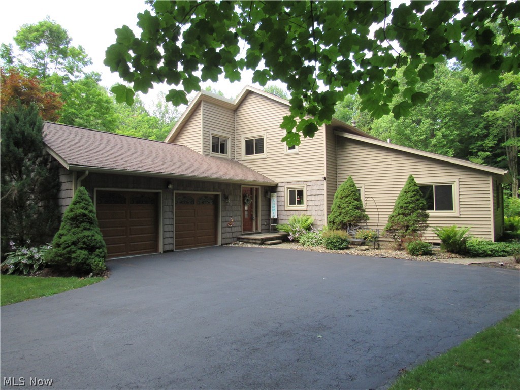 Amazing Contemporary Style Colonial with Vaulted Ceilings , Feature Windows and Expansive Decking will be a Place you will be Proud to Call Home. Lots of Quality Newer Updates from the Interior to the Exterior. New kitchen with island and stainless-steel appliances is a Chef's Delight. Huge Dining area with Hardwood floors extending into the kitchen opens out to the deck. Vaulted Great Room has fireplace and custom cabinetry which will stay. Finished Basement has Guest Quarters with a Full Bath . Lower Level also includes a Wet Bar, Theater area, Exercise area and lots of Storage. Owners Suite is Private and Peaceful with en-suit bath and walk in closet. Upstairs office has also been used as a 4th bdr or nursery for the little ones. Walk on out to the deck with a screened in Cabana, Picnic area and Gazebo with a Relaxing Hot Tub with Great Nature Views.20X14 shed has electric and ready to hold all your Toys!