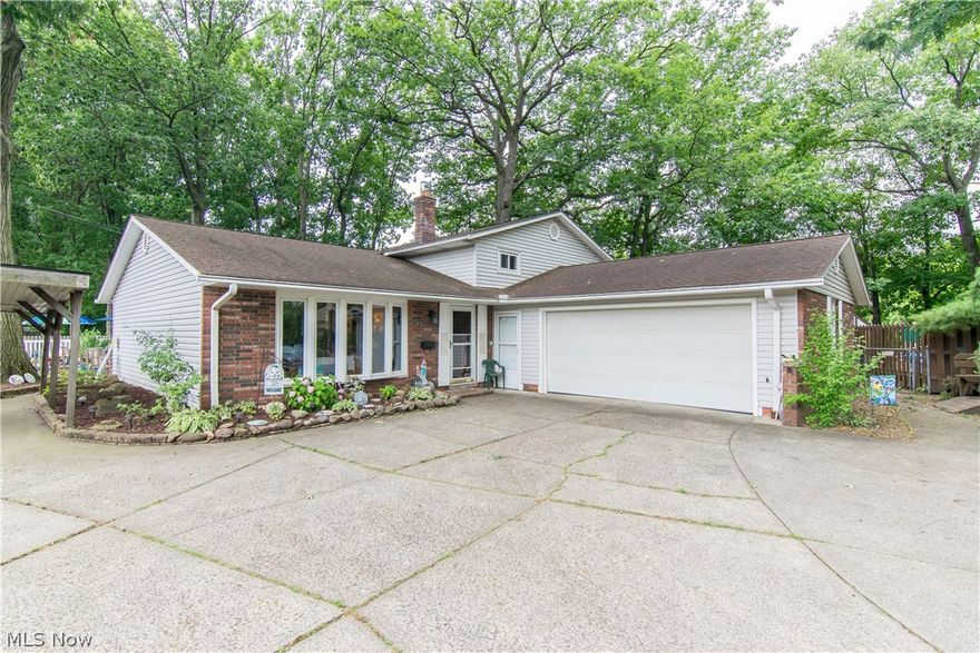 This lovingly cared for home is ready for it's new owners.  This unique 2600 square foot split level home sits on a large secluded lot and features 4 bedrooms, 3 full bathrooms including a large in-law Suite with it's own full bathroom.  The in-law suite, which features vaulted ceilings and a fireplace, could also be used as a wonderful master suite.  The finished basement adds a third living space as well as great extra storage.  The 16' x 32' in-ground, heated swimming pool makes for great summer fun and the park-like rear lot makes this unique property nearly 3/4 acre of nicely wooded, fenced in space, including a 1200 square foot patio area.  Great location, just minutes from 480.