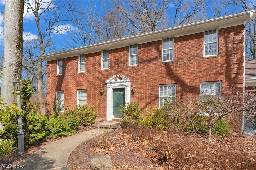 Timeless elegance meets classic Colonial charm in this stunning 4-bedroom, 2.5 bath Canfield treasure. Rich cherrywood cabinetry flows throughout, anchoring a chef's kitchen with a gorgeous granite breakfast bar and glass front cabinetry.  The dining room is stunning -- wrapped in large windows that flood the space with natural light. Gather around the fireplace in the cozy family room with its built-in shelves, host friends in the formal living room, or retreat to the refined library — lined with built-in cherry cabinetry that ooze stateliness and invites rich conversation. Generously sized bedrooms offer the space and closets today's buyers crave, and the upstairs laundry room delivers the everyday convenience you didn't know you were missing.  The partially finished basement is perfect for casual relaxing, a home gym, or a hobby area.  Storage abounds in the unfinished area.  Step outside to a quiet, private backyard oasis tucked on three sides by the home itself, complete with a covered overhang and handy storage shed — the perfect escape. Car enthusiasts and makers will love the immaculate tiled garage with its attached woodworking shop. All of this in a desirable neighborhood, within the sought-after Canfield Local School District. Homes with this kind of character and craftsmanship rarely come available — don't miss your chance.