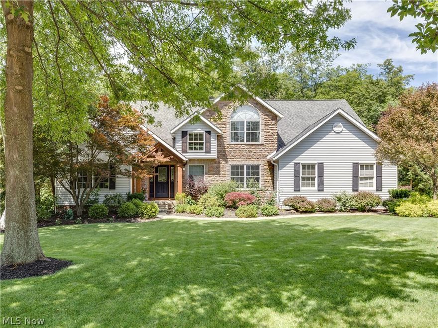 Perfect home for entertaining, inside and out.  Main floor features office with built-ins and a half bath, vaulted great room with three-sided fireplace, master suite with balcony, formal dining room, kitchen with center island, under cabinet lighting and granite, and eating area, laundry, mudroom, half bath, and access to decks with retractable awning.  Upper level offers two bedrooms with jack and jill bath and a 4th bedroom across the catwalk. Finished lower level with fireplace, full kitchen bar, den, full bath and bonus room, plus walk-out to multi-level Timber Tech decks and hot tub looking out to heavily wooded, private rear yard.  Start living the Dream today.