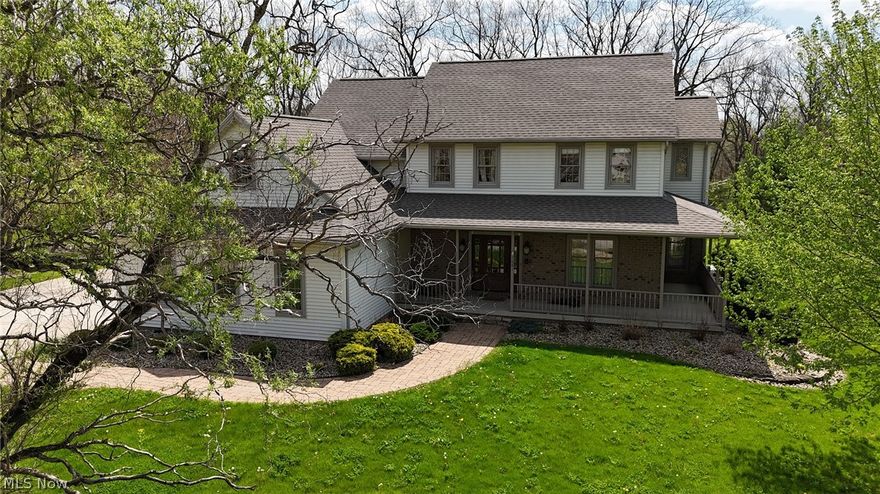 Welcome to this beautifully maintained 4-bedroom, 3.5-bath Colonial tucked away on a desirable cul-de-sac in Austintown! Situated on a spacious, wooded lot, this home offers the perfect blend of privacy, comfort, and functionality.

A welcoming front porch and paver walkway set the tone as you enter into a bright foyer that flows into both formal and casual living spaces. The updated kitchen is the heart of the home, featuring abundant cabinetry, granite countertops, a large center island, pantry, and a sun-filled dining area?ideal for everyday living and entertaining. The kitchen opens seamlessly to the spacious family room, highlighted by a cozy fireplace.

Upstairs, the owner?s suite offers vaulted ceilings, a generous walk-in closet, and a private en-suite bath. Three additional bedrooms, a full bath, convenient second-floor laundry, and a versatile bonus room provide flexible space for family, guests, or a home office.

The finished lower level expands your living space with a recreation area, bar setup, full bath, and plenty of storage?perfect for entertaining or relaxing. Step outside to enjoy the private backyard featuring a patio area, ideal for gatherings or quiet evenings.

Additional highlights include a 3-car attached garage, whole house generator, and numerous updates throughout. Located in Austintown Local Schools and close to shopping, parks, and everyday amenities, this home checks all the boxes.