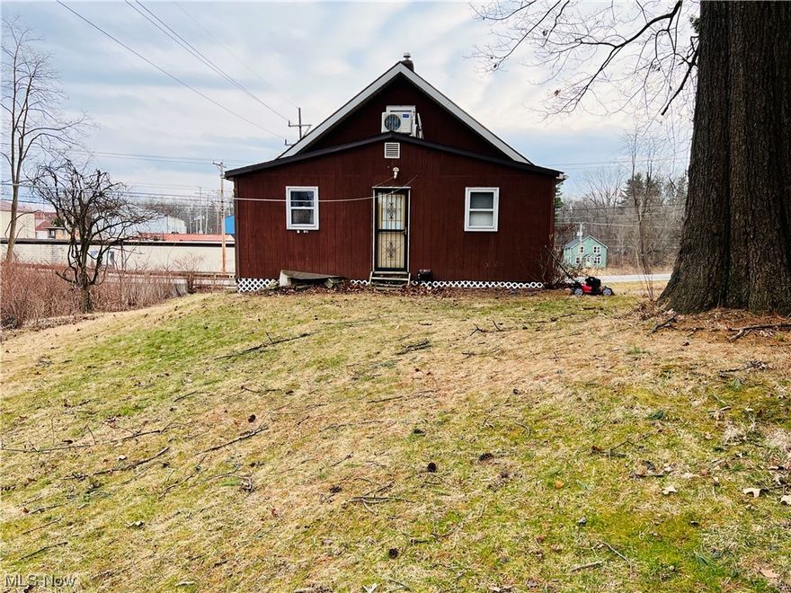 If you're looking for privacy on a large lot, look no further!  This bungalow has a walk out lower level with an attached garage, the main level has two bedrooms, a full bathroom, laundry room, living room kitchen and walk in pantry.  Upstairs are two additional, sizable bedrooms.  The home is currently tenant occupied with the tenant making plans to vacate.  In need of some TLC but there is quite a bit of potential here.  Please note the square footage was calculated at 1,040 on the main level with an additional 342 sq ft on the second level for a total of 1,382 although the Auditor only has 780 listed. Updates include newer roof, some newer windows and septic system.  Adjacent to Miller Park.