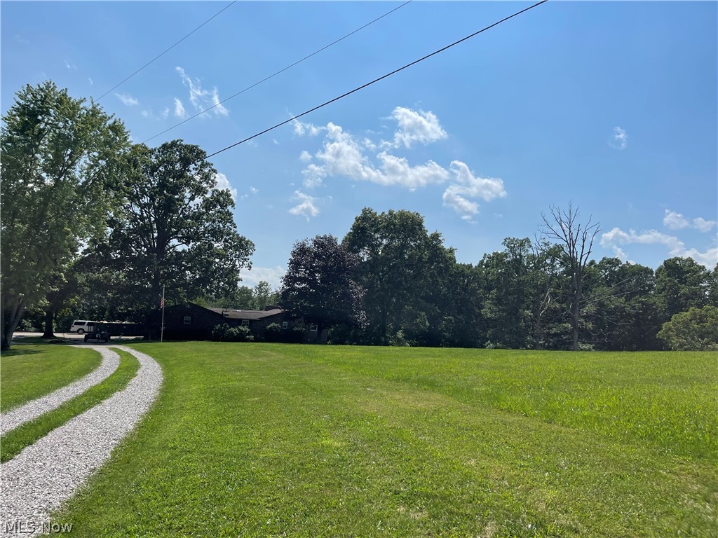 Picture Perfect Private Country Setting!!! This property features a Chefs Kitchen with feet of cabinet space with built in bread drawers , pill outs and spice turntables......a custom 8' Island..2 Wood Burning fireplaces the one off the kitchen has a built in indoor charcoal grill with exahust fan...1st Floor Laundry 3 Bedrooms, 3 Bathrooms on the first floor... Full walk out Basement with wood burning fire place rec room is 30 x 18'.. Utility room is stubbed for an additional kitchen and bath... this home also features a 30' screened in porch overlooking the woods... an oversized 2 car garage and a horseshoe driveway!