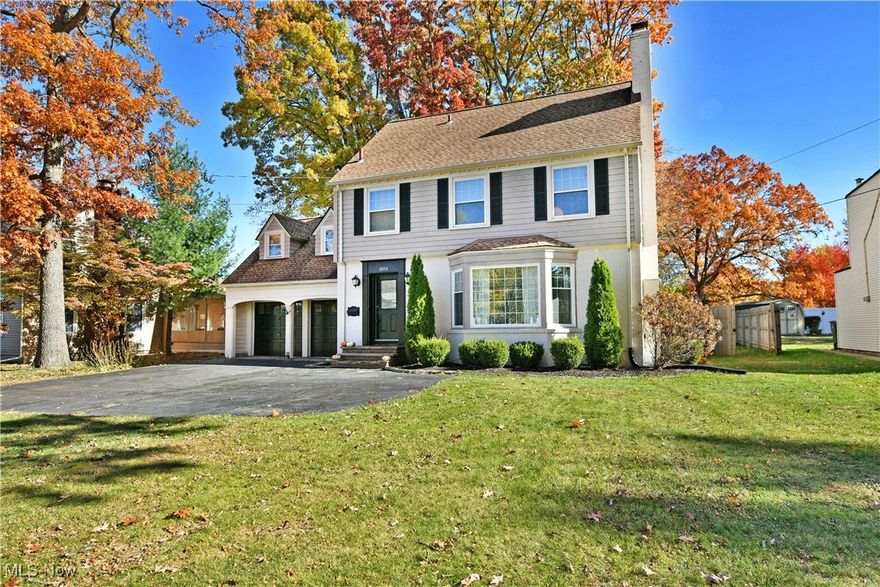 A beautiful blend of classic Warren architecture and modern updates, this tastefully remodeled two-story home is sure to take your breath away. Nestled among colorful fall foliage, the prominent exterior delights with its oversized bay window, gabled garage doors, and decorative entry door, all tied together by manicured landscaping. A large fenced-in backyard adds to the appeal, offering plenty of patio space to relax or enjoy the views from the screened-in rear sunroom as you curl up with a good book and your favorite beverage. Inside, a stained wood staircase leads to the second-floor bedrooms, while an expansive living room with a central fireplace is bathed in natural light from tall lattice windows. Beautiful hardwood floors flow throughout, continuing into the dining room, separated by French doors. The remodeled kitchen impresses with dark tile flooring, stone countertops, and a glass-tiled backsplash, complemented by sleek stainless-steel appliances that stay. Upstairs, a large bedroom extends over the garage with dual dormer windows and built-in cabinetry for all your storage needs. The secondary landing reveals even more built-ins found just before the oversized full bath with dual vanities and rich tilework. Three nicely sized bedrooms include a converted walk-in dressing room that joins the spacious guest bedroom with dual closets and built-ins, and the master bedroom suite. The master bedroom offers a large closet and its own private full bath with a custom-tiled shower. If that’s not enough, a partially finished basement provides additional living space with a cozy family room and a charming half bath. The unfinished side provides a convenient laundry area, complete with a washer and dryer, plus plenty of extra storage space. Updates include: vinyl replacement windows, hot water tank 2020, three trees removed 2022, epoxy garage floor 2021, updated landscaping 2022, and more! Plus a one-year home warranty.