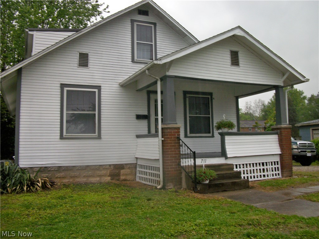 CHARMING BUNGALOW RENOVATED AND READY IN BELPRE,OH! Here's an opportunity for home ownership with this "cute and cozy" 2 BD / 1 bath home sitting on an oversized lot with a nice-size deck for hosting BBQS & entertaining. Located in a quiet neighborhood with easy access to highways and shopping. Well laid out 1,332 Sq. Ft. home with first floor featuring generous-size family room with decorative fireplace with an adjoining dining area & eat-in kitchen with lots of cabinet space. Second floor offers 2 nice-size bedrooms with a bonus room for "what-ever". Hall area could be used for computer room. Lower level has utility/laundry room & lots of storage. Each room painted top to bottom with neutral decor, new flooring thru-out and bathroom updates. Now ready for your finishing touches. Just bring your belongings & move right in.