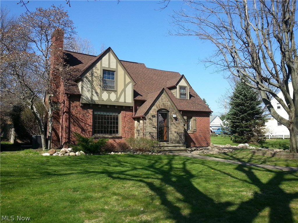 Exceptional English Country Cottage Tudor located on 2 lots in Historic Ridgewood. Old World charm from the stone front entry to the leaded glass windows and wrought iron gated court yard. 22x15 deck and Sunroom w/tile floor overlook a private parklike backyard setting with partial privacy fence, a rustic stone wall, rock formation landscaping, gravel paths and playset. Updates include: Roof 2006, furnace, A/C & HWT-2009. Stainless steel appliances, Corian counter tops, breakfast bar and laminate flooring-2010 ( Some new cabinet doors in 2016) Updated electric ( wiring, outlets, & breaker box). Updated plumbing ( replaced galvanized pipes everywhere except half bath) 2010. Water softener 2010, Exterior paint -2015. 13x12 Sunroom rubber roof-2016 ( 40 year warranty). Some updated windows. Spacious formal LR with wood burning fireplace ( gas line installed) and a first floor family room and also a finished rec room with wood burning fireplace ( gas line installed) and original knotty pin