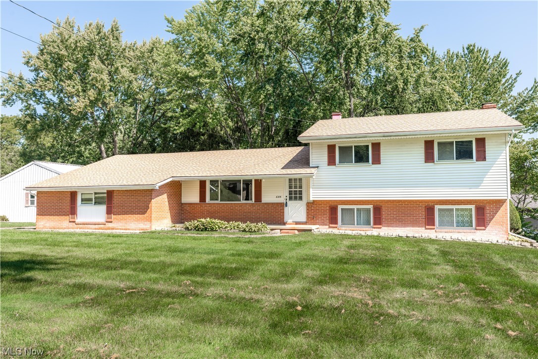 As you approach this spacious split-level home, you'll be greeted by the covered front porch, perfect for enjoying your morning coffee or relaxing in the evenings. Step inside to find a large living room, ideal for entertaining family and friends. The adjacent eat-in kitchen features a pantry and plenty of cabinets for all your storage needs. The main level is completed by a two-car attached garage with workshop area, providing ample space for all your projects. Hardwood floors grace most of the rooms and the entire house has been freshly painted, giving it a clean and inviting atmosphere. The lower level offers a cozy family room with sliding glass doors that lead to a patio. Additionally, this level includes an office space, fourth bedroom, and bath with shower. On the top floor, you'll find three bedrooms along with another full bath. This layout provides privacy and convenience for the whole family. Car enthusiasts will be delighted by the detached four-car garage, which is a mecha