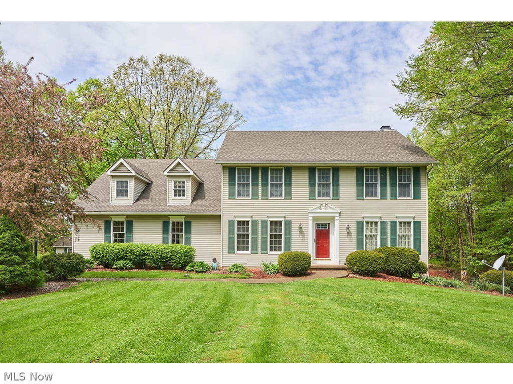 Welcome to this 4 bed, 4 bath colonial in Bath Township. Revere Schools! Foyer flanked by living and dining rooms. Living room currently used as an office. Open floor plan with spacious kitchen includes all appliances and is open to vaulted three season sunroom. Family room with gas fireplace and sliders to deck. Sprawling, private, vaulted master suite, with additional sitting room, h/h walk-in closets and master bath with dual sinks, whirlpool tub and shower. Three additional bedrooms, one with ensuite bath, perfect for guests and full hall bath complete the second floor. Convenient first floor laundry with newer front load washer and dryer. Lower level recreation room and office with newer carpeting, walks out to patio areas including stamped concrete. Basement plumbed for bath. Three car garage and beautiful backyard with storage shed. Recent updates include, Roof (2012), hot water tank and water softener. Clean, efficient Geothermal heating and cooling. Make this your home t