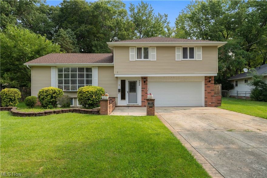 This beautiful Richmond Heights split-level home has so much to offer! The long driveway accented with brick borders leads you to an inviting exterior with landscaped garden beds. Inside, you are welcomed by a foyer stepping up the large living! The living room has a large bay front window allowing for tons of natural light and hardwood flooring that continues through to the dining area! The dining area allows for spacious seating along with more natural light flowing from windows overlooking the backyard! The eat-in kitchen features beautiful oak cabinets that wrap around the room and tons of counter space! Upstairs are 3 spacious bedrooms, all with tons of closet space and hardwood flooring! The full bath is also upstairs! Plus, this home offers even more living space with a finished, walkout basement! This large space is perfect for a home office, rec room or playroom plus a bonus room that can be used for storage or home gym and a separate laundry area! Outside you will find a huge