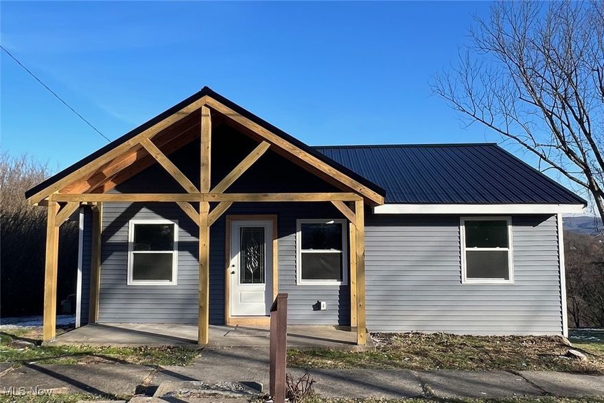 Enjoy the beautiful panoramic view off the new back deck!  This 3 bedroom home has been renovated throughout.  New siding, windows and roof.  Interior has new drywall, flooring, electrical, plumbing, furnace , A/C, a beautiful eat-in kitchen with new cabinets, sink, fixtures and lighting.  Living room, 2 bedrooms and a full bath complete the main level.  3rd bedroom in the lower walk-out basement.  Come take a look!