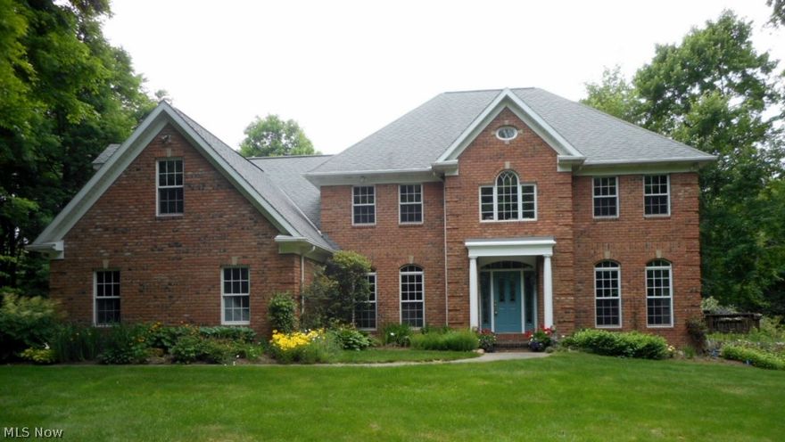 Custom built beauty built by Art Graf. Tucked in this private 4.59 acres. 20 ft soaring ceilings in great room with 18 foot windows to view the private wooded setting, back staircase from great room to second floor. Master with trey ceiling and a sitting room. Oversized crown moldings, pella windows, amish built black walnut cabinets in kitchen. Custom cabinets in bathrooms too.