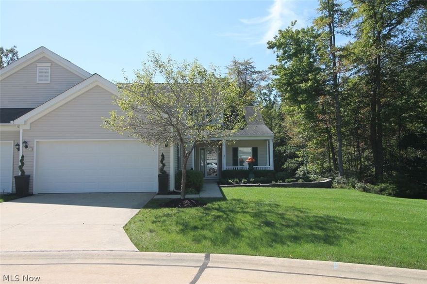 Stunning two bed/three bath Cluster! Open, spacious two story LR/GR with marble faced gas burning fireplace on a raised marble hearth and windows providing exceptional light. Bright, airy den/television room off great room with crown molding includes two walls of more windows and direct access to a wrap around deck. Three season room with windows looking out to the wetlands is functional throughout the year with heat and a/c. Three season room includes French doors off the dining area, display shelving around the perimeter and access to the wrap around deck. Kitchen has large high-end cabinets complete with under cabinet lighting, built in wine rack, lots of counter space with Corian counter tops, curved breakfast bar and new track lighting. New high-end suite of GE appliances.  First floor laundry includes new commercial grade washer and gas dryer. Large 1st floor master suite with crown molding, built in bookcase with storage, large walk in closet and a wall of windows opening up to