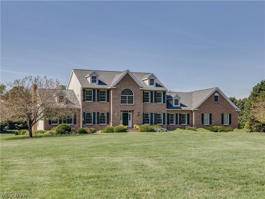 Unbelievable 4 BR/3.5 BA quality custom built colonial with 4106SF (all above grade) on 4.6 acres with pond & bordering Seven Hills golf course. This home boasts 2 vaulted master bedrooms (1st & 2nd floor), 4.5 car side load garage & lovely tranquil views* Quality features incl. vaulted & 9' ceilings (1st flr), granite, stainless, 6 panel wood doors, extra wide trim, crown molding with custom cornices, Anderson windows, updated sky lights & shingles with ice guard (2014), security system, 300 amp service, geothermal heat/cooling (total utility avg. $219/mo.), 12 course unfinished basement & approx. 2/3 brick exterior* Interior...start with the 2 story foyer with turned stair case & Vermont slate floor* Formal dining with French doors* Bayed oak kitchen with updated granite & stainless appliances, island, pantry, roll out shelves, desk, eating area with slider to 38x20 deck & beautiful mega view*  Vaulted great room with brick wood burning fireplace* Office with wall of built in cabinet