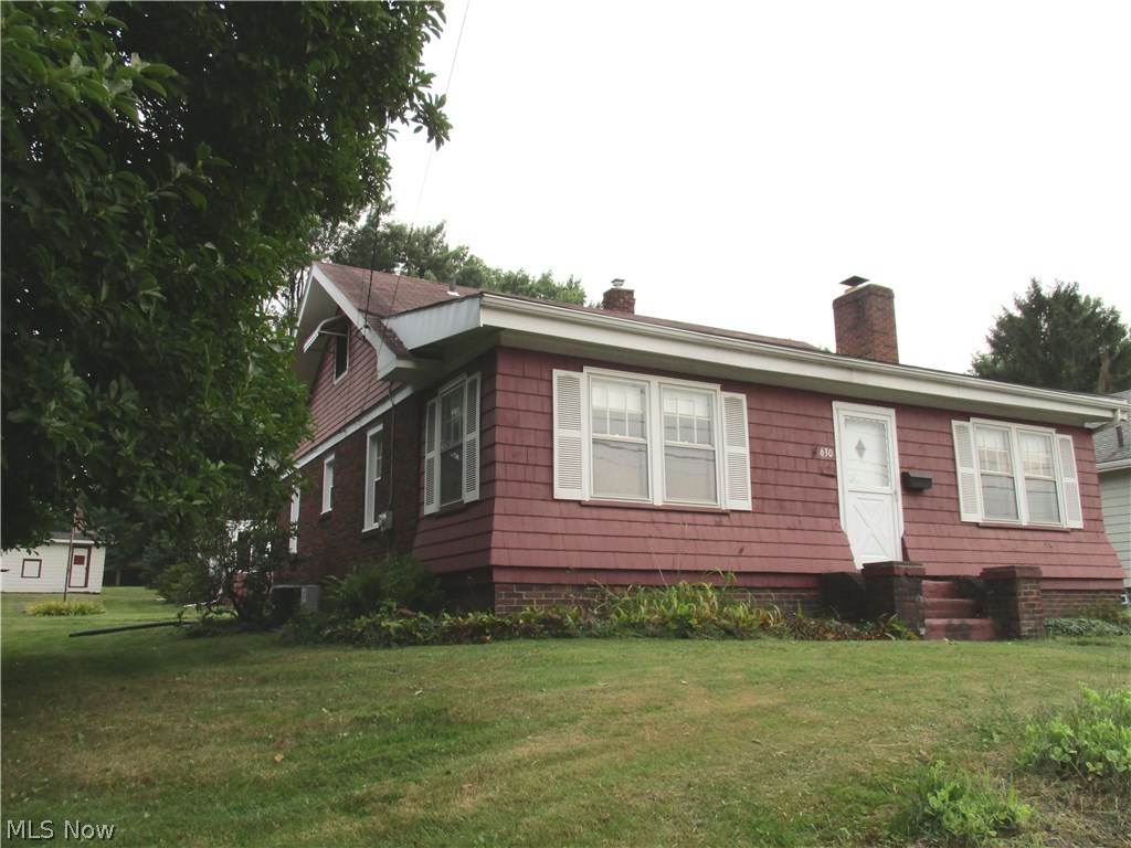 This home has 4 city lot. (Approx 0.68 of an acre.) Conveniently located across the street from Trails End Park...This 3 Bedroom Bungalow has a large eat-in Kitchen, Living room with Fireplace, enclosed front porch.... Large 2 car garage with enclosed patio room w/ wood stove.