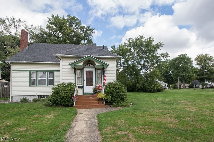 Enjoy the charm of this spacious home with original hard wood floor throughout has large eat in kitchen plus formal dining room, oversize living room, first floor bedroom and full bathroom, 2 bedrooms upstairs with walk in closets and full bath. Spacious 4 season room! Full basement.  Home is on a double lot which provides a nice big yard and room for addition. Great 1.5 car garage w/electric. Sold As-Is.