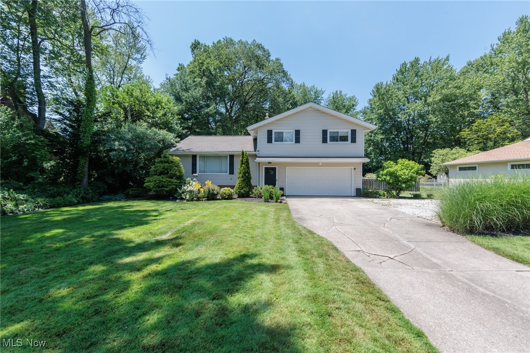 Welcome to this beautiful split-level home tucked away in the heart of Brecksville! From the moment you step inside, you’ll appreciate the spacious, open-concept layout featuring rich oak hardwood floors throughout the main living areas. The kitchen features quartz countertops and stainless steel appliances, making it a perfect space for everyday cooking or entertaining.
Enjoy easy access to the large backyard deck through the recently replaced sliding glass doors (2024), ideal for relaxing evenings or summer get-togethers. Upstairs, the home offers three generously sized bedrooms and a full bathroom upgraded with modern tile finishes, dual sinks, and updated lighting.
The lower level features a comfortable family room and a utility space enhanced by glass block windows, perfect for storage, hobbies, or a play area. Major mechanical updates include a sump pump with hydro backup (2019), radon mitigation system (2022), relocated and upgraded Carrier deluxe A/C system (2024). Additional improvements include chimney repointing, fence installation, drainage and landscaping work (2025), and more.
Enjoy peace and privacy in the large, wooded backyard while still being within walking distance of the Metroparks, Towpath Trail, and scenic railroad, with quick access to I-77 and I-80. This home has been lovingly maintained and is truly move-in ready—don’t miss your chance!