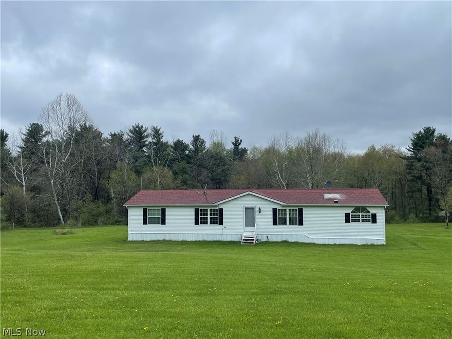 A MUST SEE! Enjoy the sweet serenity of over 4 acres of land to call yours! This beautiful modular home boasts a master suite including double sinks, a separate bathtub and shower as well as a walk-in closet off the bathroom. It also has 3 more large sized bedrooms.  All appliances stay including the Washer/Dryer. Enjoy the view of your back yard and take in nature's wildlife from your large back deck. Well and Septic has passed county inspection. This home is ready for you to move right in! Call me today!